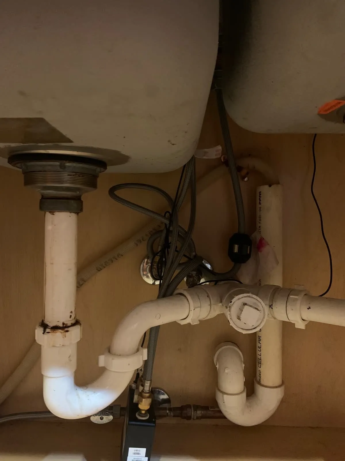 Under-sink drain piping in a residential kitchen